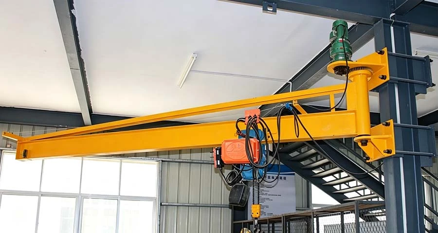 Beam mounted jib crane at an assembly workstation Beam mounted jib crane at an assembly workstation